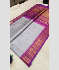 Lite Sky Blue and Magenta color gadwal pattu handloom saree with All over Buttas Design-GDWP0000808