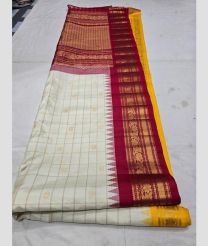 Half White and Yellow gadwal pattu sarees with All over Buttas design