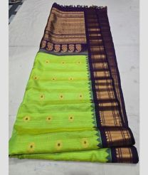 Parrot Green and Dark Chocolate gadwal pattu sarees with All over Buttas design