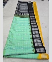 Lite Turquoise and Yellow gadwal pattu sarees with All over Buttas design