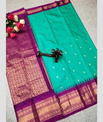 cyan and purple colour gadwal pattu sarees with All over Buttas design