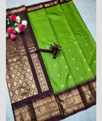 green and silver colour gadwal pattu sarees with All over Buttas design
