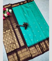 cyan and brown colour gadwal pattu sarees with All over Buttas design