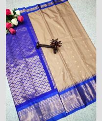 silver and tan colour gadwal pattu sarees with All over Buttas design