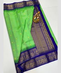 green and silver colour gadwal pattu sarees with All over Buttas design