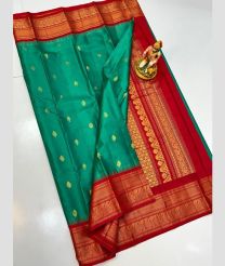 blue and  brown colour gadwal pattu sarees with All over Buttas design