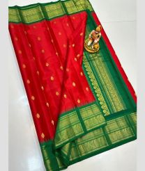 magenta and green colour gadwal pattu sarees with All over Buttas design