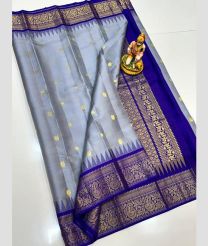 gray and blue colour gadwal pattu sarees with All over Buttas design