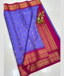 blue colour gadwal pattu sarees with All over Buttas design