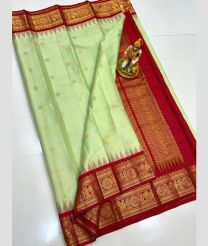 light green and brown colour gadwal pattu sarees with All over Buttas design
