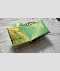 light green colour gadwal pattu sarees with All over Checks and Buttas design