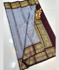 light blue colour gadwal pattu sarees with All over Buttas design