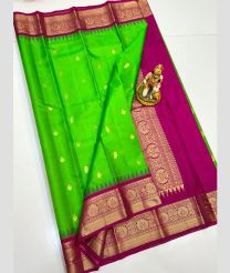 green colour gadwal pattu sarees with All over Buttas design