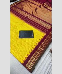 yellow and brown colour gadwal pattu sarees with All over Lines design