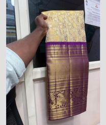 Cream and Purple kanchi lehengas with all over jari design