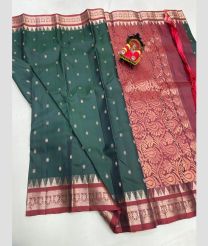 teal and silver colour kanchi pattu sarees with All over Buttas design