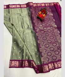 light green and silver colour kanchi pattu sarees with All over Buttas design