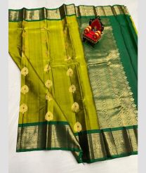 olive green colour kanchi pattu sarees with All over Buttas design