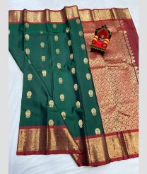 dark  green colour kanchi pattu sarees with All over Buttas design