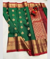 green and brown colour kanchi pattu sarees with All over Buttas design