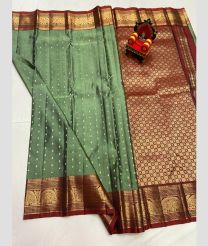 brown and green colour kanchi pattu sarees with All over Buttas design