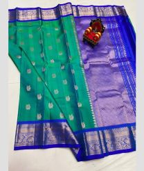 green and blue colour kanchi pattu sarees with All over Buttas design