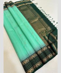 light blue colour kanchi pattu sarees with All over Buttas design