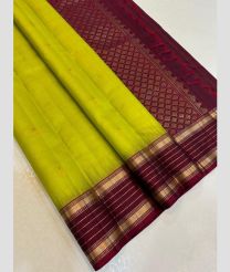olive and magenta colour kanchi pattu sarees with All over Buttas design