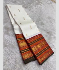 white colour kanchi pattu sarees with All over Buttas design