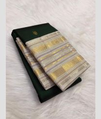 green colour kanchi pattu sarees with All over Buttas design