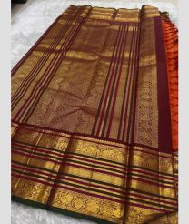 brown and purpel colour kanchi pattu sarees with All over Buttas design