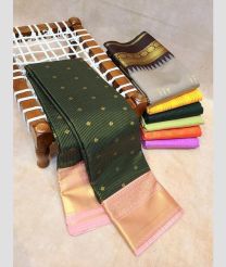 forest green colour kanchi pattu sarees with All over Buttas design