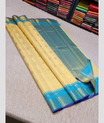 cream and blue colour kanchi pattu sarees with All over Buttas design