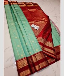 light blue and brown colour kuppadam pattu sarees with All over Buttas design
