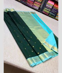 green and silver colour kuppadam pattu sarees with All over design