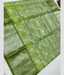 silver and light green colour venkatagiri pattu sarees with All over Checks and Buttas design