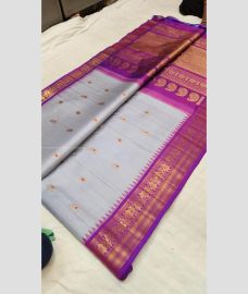 Lite Sky Blue and Magenta color gadwal pattu handloom saree with All over Buttas Design-GDWP0000808