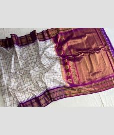 White and Magenta gadwal pattu sarees with All over Checks and Buttas design