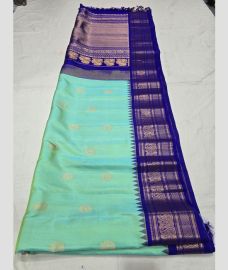 Turquoise and Royal Blue gadwal pattu sarees with All over Buttas design