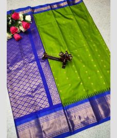 silver and green colour gadwal pattu sarees with All over Buttas design