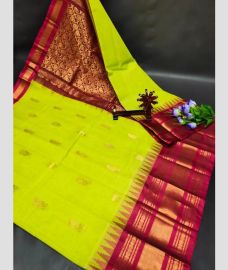 light green colour gadwal pattu sarees with Kanchi Border design