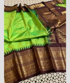 olive green colour gadwal pattu sarees with Temple Border design