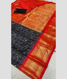 navy blue colour gadwal pattu sarees with All over Buttas design
