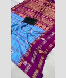 blue colour gadwal pattu sarees with All over Buttas design