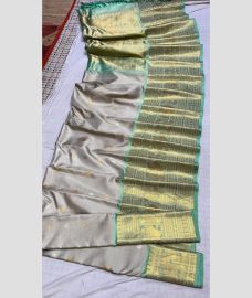 silver colour gadwal pattu sarees with All over Buttas design