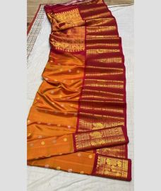 brown colour gadwal pattu sarees with All over Buttas design