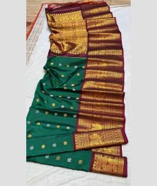 blue colour gadwal pattu sarees with All over Buttas design
