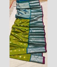 green and silver colour gadwal pattu sarees with All over Buttas design