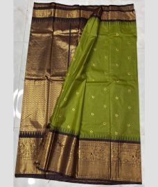 green and brown colour gadwal pattu sarees with All over Buttas design