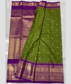 green and silver colour gadwal pattu sarees with All over Buttas design